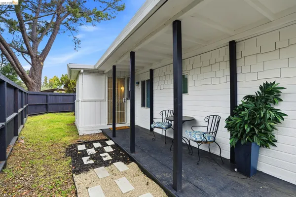 a backyard of a house with seating space