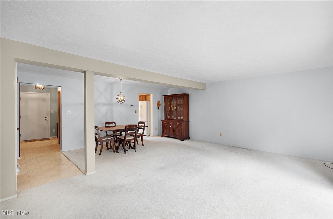 6474 State Road, Unit I10 Parma, OH 44134 - Photo 12 of 31 Dining area featuring light carpet