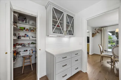 a living room with hard wood floors