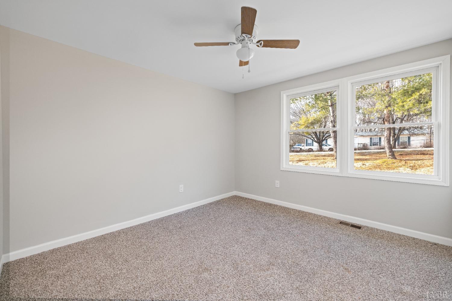 3936 Goodview Road Goodview, VA 24095 - Photo 18 of 29 an empty room with windows