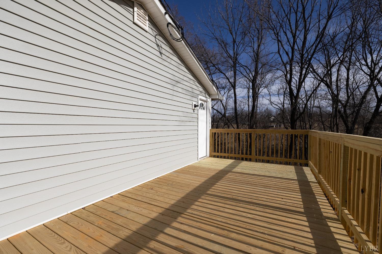 3936 Goodview Road Goodview, VA 24095 - Photo 7 of 29 a view of backyard with a deck