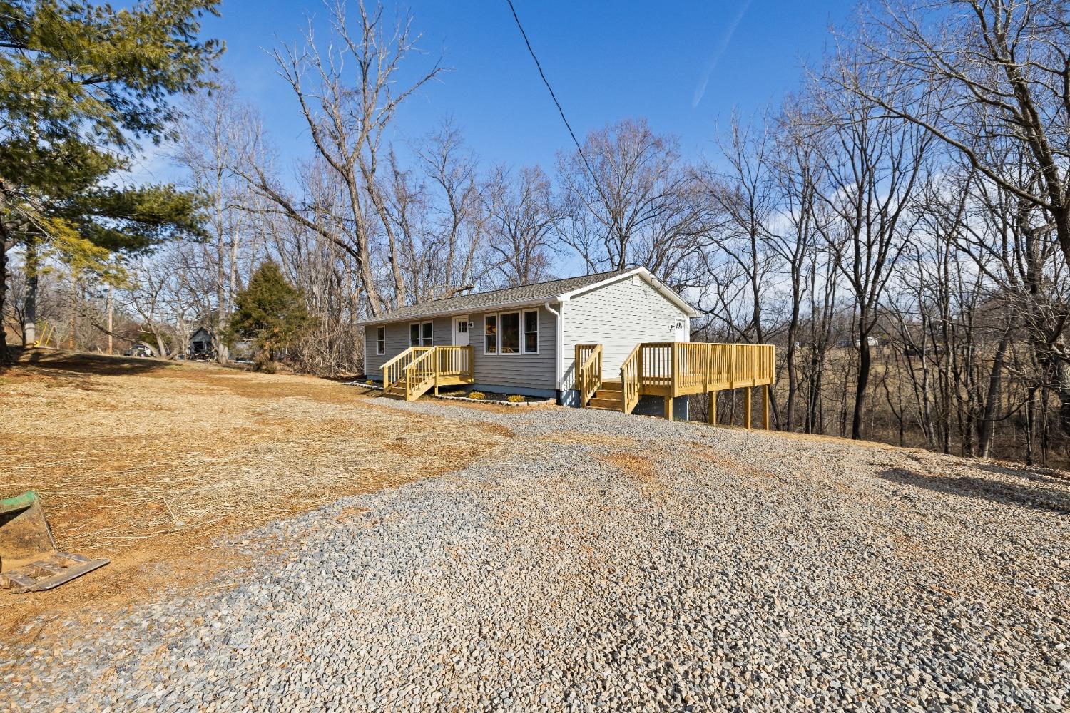 3936 Goodview Road Goodview, VA 24095 - Photo 9 of 29 a front view of a house with a yard covered in snow