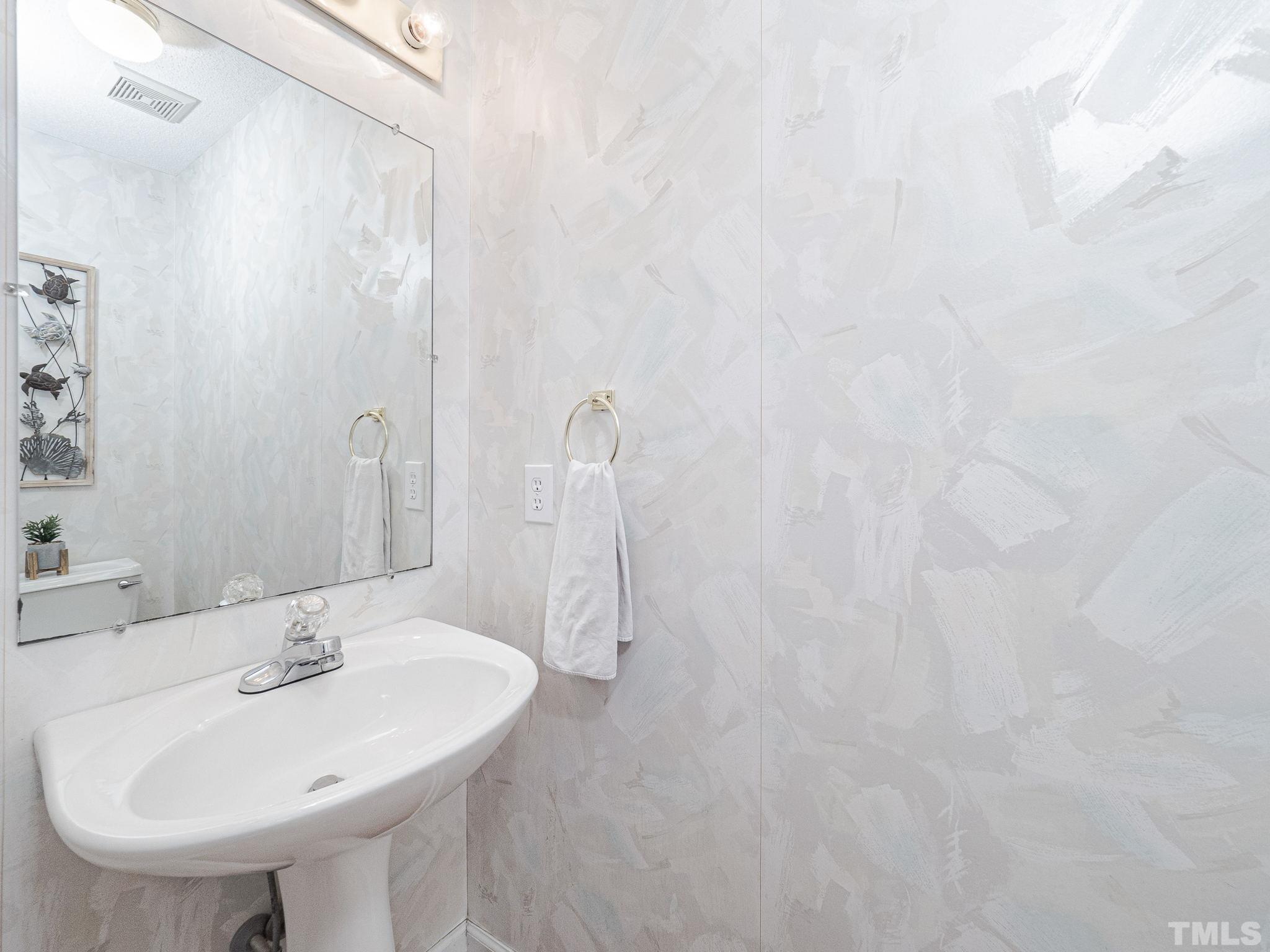 106 Kingsmill Road Cary, NC 27511 - Photo 11 of 31 a bathroom with a sink and a mirror