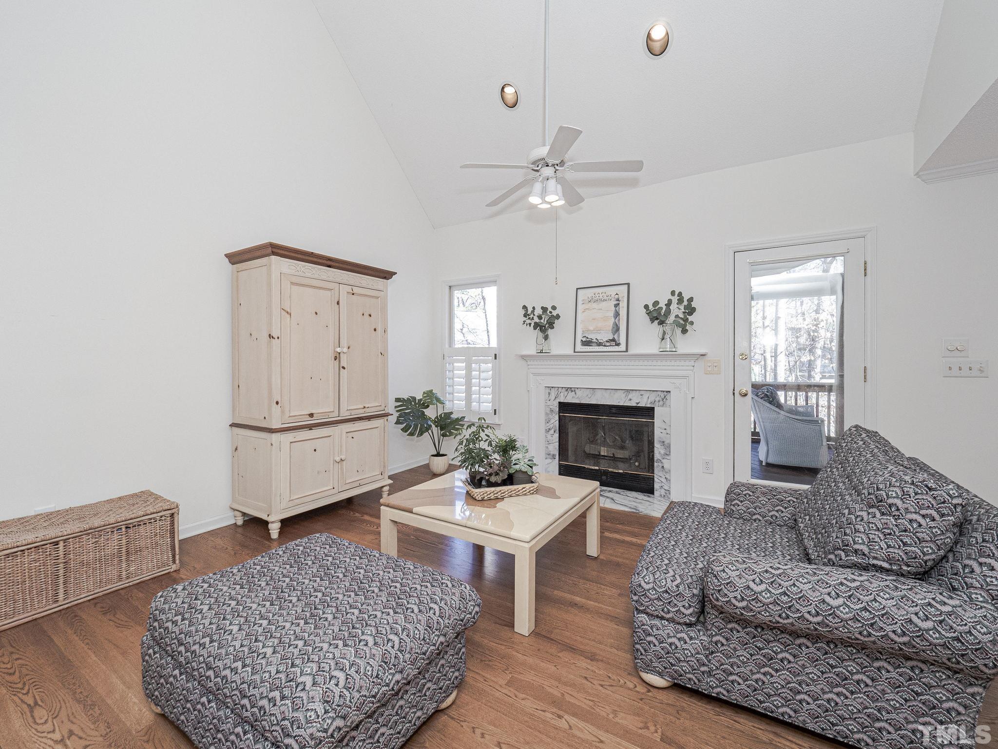 106 Kingsmill Road Cary, NC 27511 - Photo 12 of 31 a living room with furniture and a fireplace