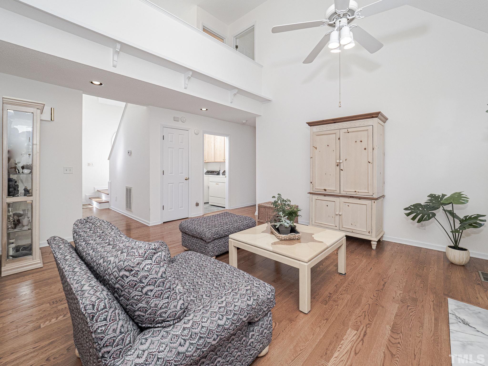 106 Kingsmill Road Cary, NC 27511 - Photo 15 of 31 a living room with furniture and a wooden floor