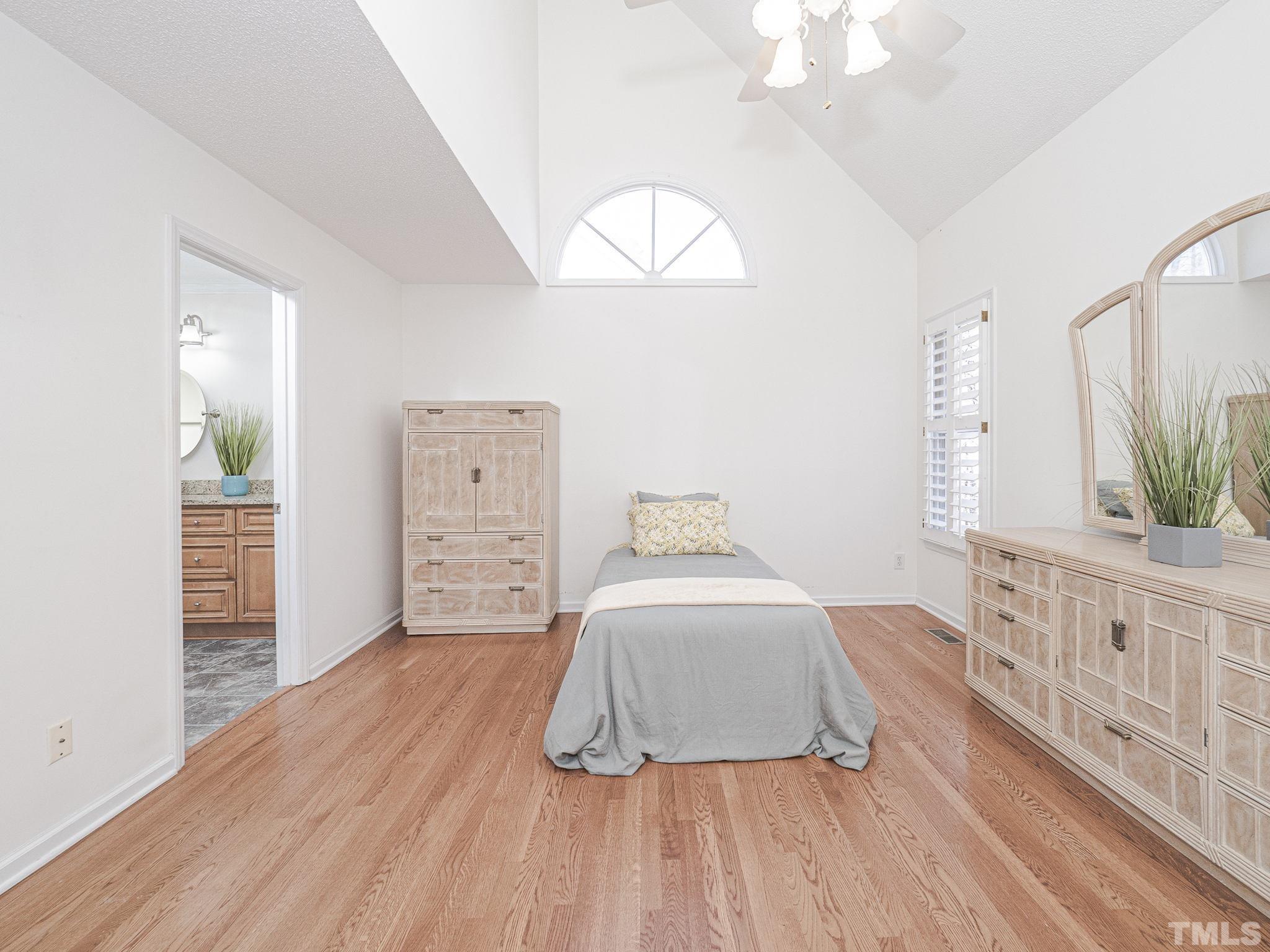 106 Kingsmill Road Cary, NC 27511 - Photo 18 of 31 a bedroom with a bed and a window