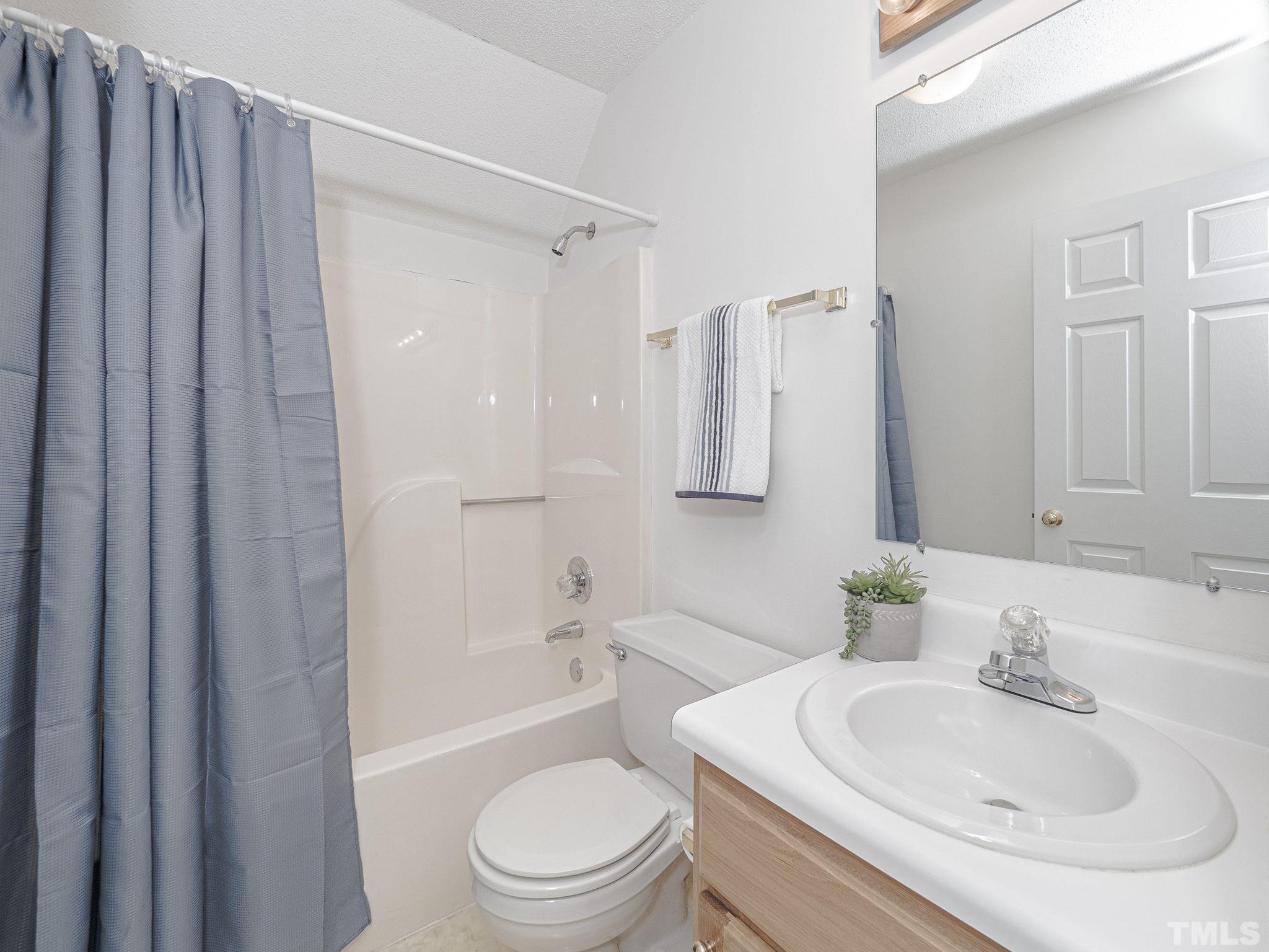 106 Kingsmill Road Cary, NC 27511 - Photo 23 of 31 a bathroom with a sink toilet and shower