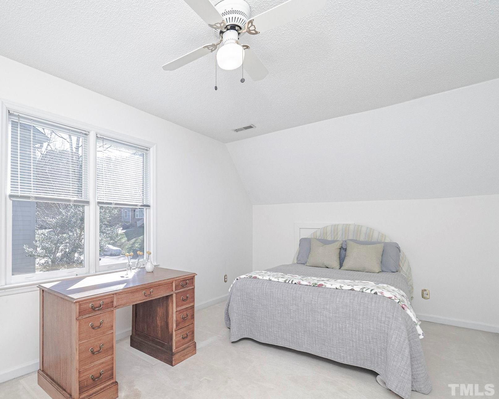106 Kingsmill Road Cary, NC 27511 - Photo 24 of 31 a bedroom with a bed and window