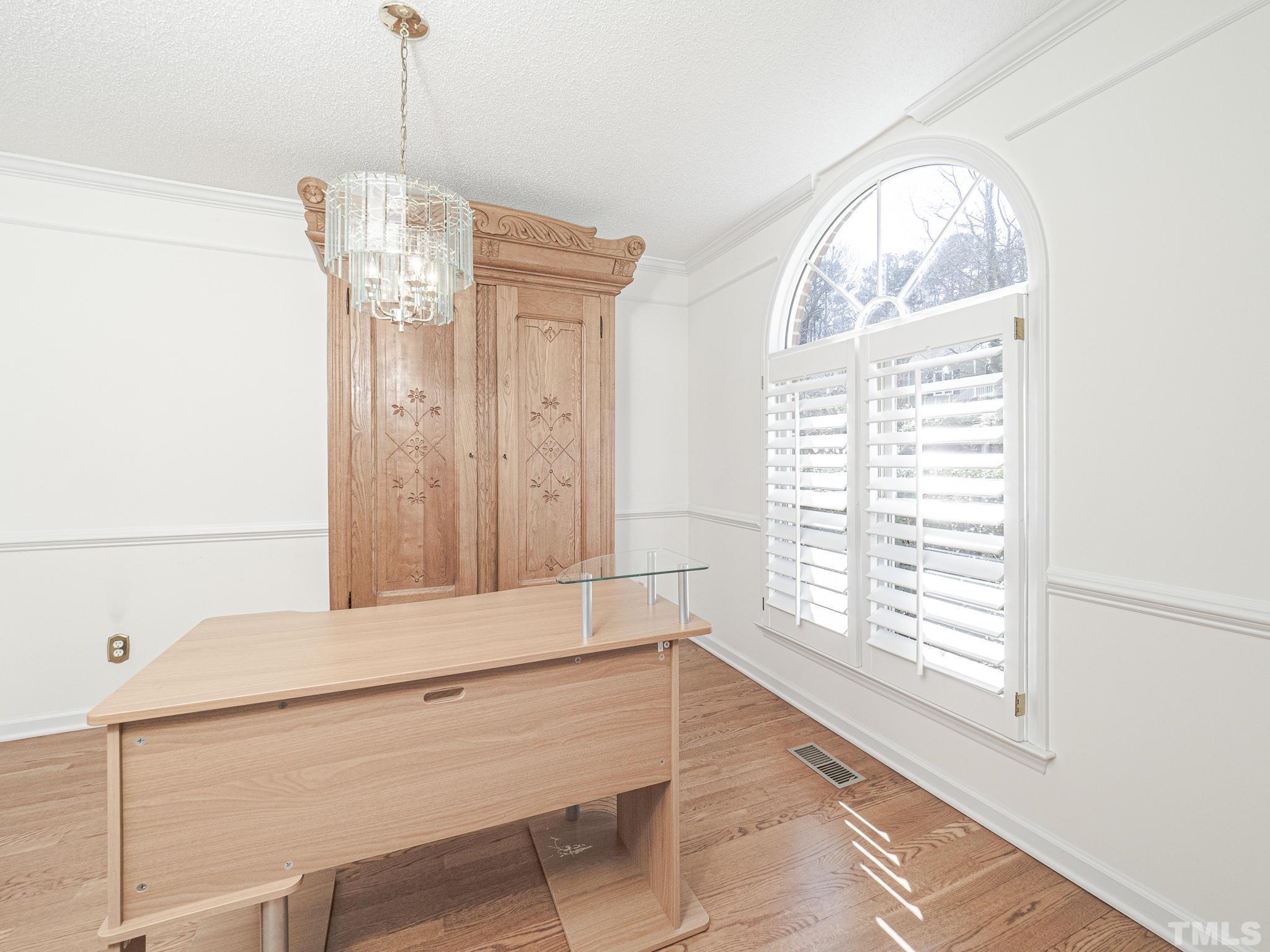 106 Kingsmill Road Cary, NC 27511 - Photo 5 of 31 a view of a room with a window and wooden floor