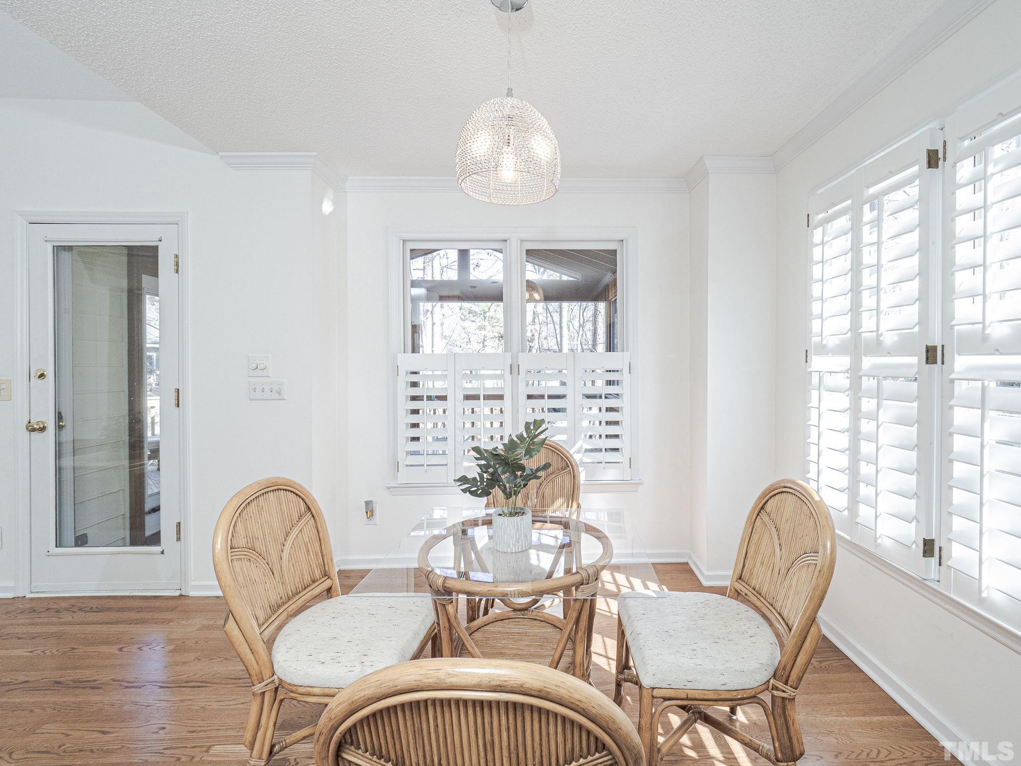 106 Kingsmill Road Cary, NC 27511 - Photo 9 of 31 a view of a dining room with furniture window and wooden floor