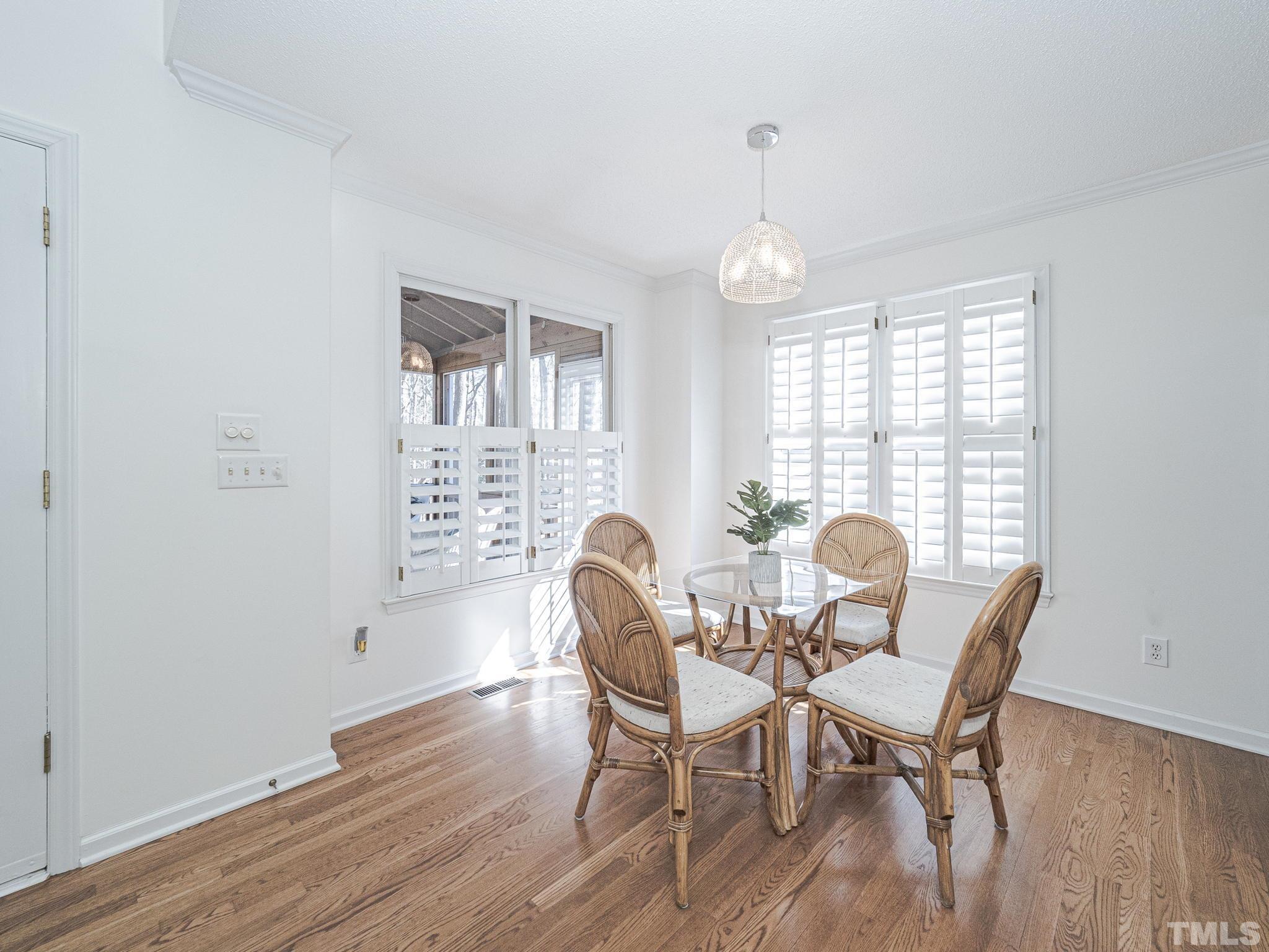 106 Kingsmill Road Cary, NC 27511 - Photo 10 of 31 a view of a dining room with furniture window and wooden floor