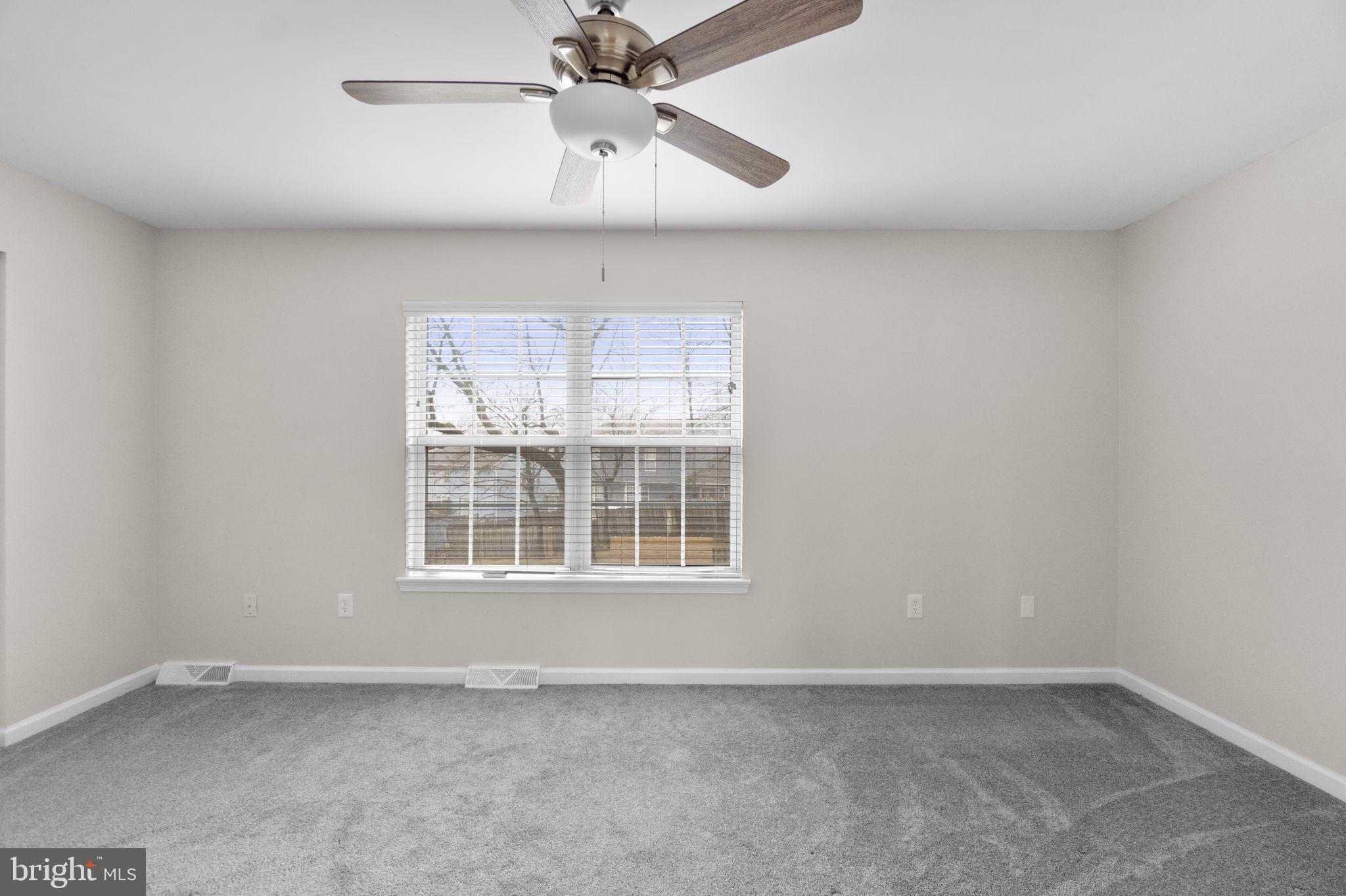 930 Gaming Square Hampstead, MD 21074 - Photo 23 of 36 an empty room with a window and a fan