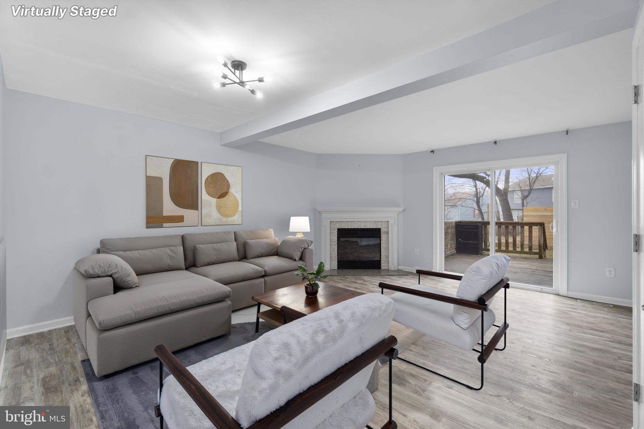 930 Gaming Square Hampstead, MD 21074 - Photo 3 of 36 a living room with furniture and a fireplace