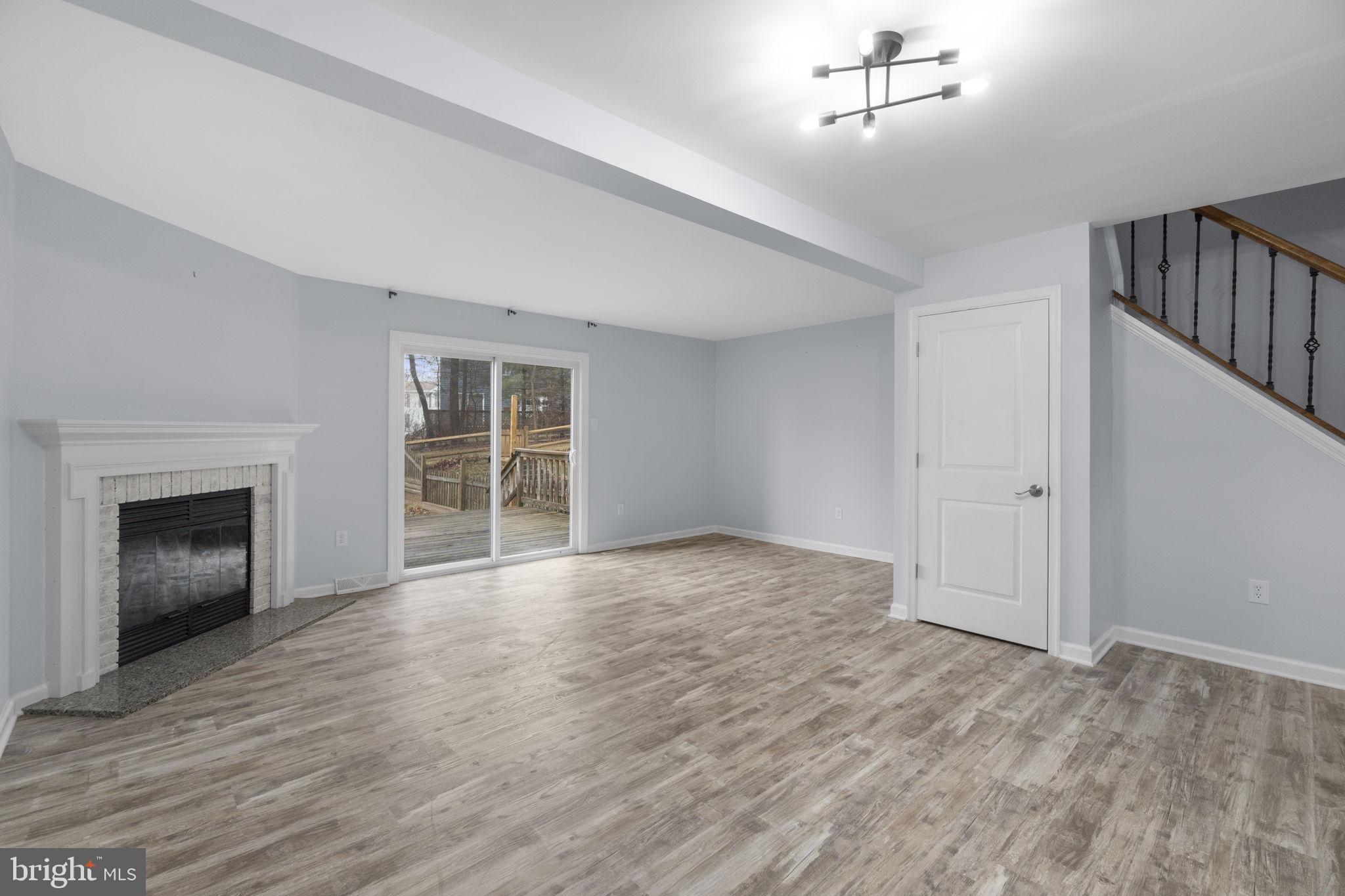 930 Gaming Square Hampstead, MD 21074 - Photo 6 of 36 a view of an empty room with a window and fireplace