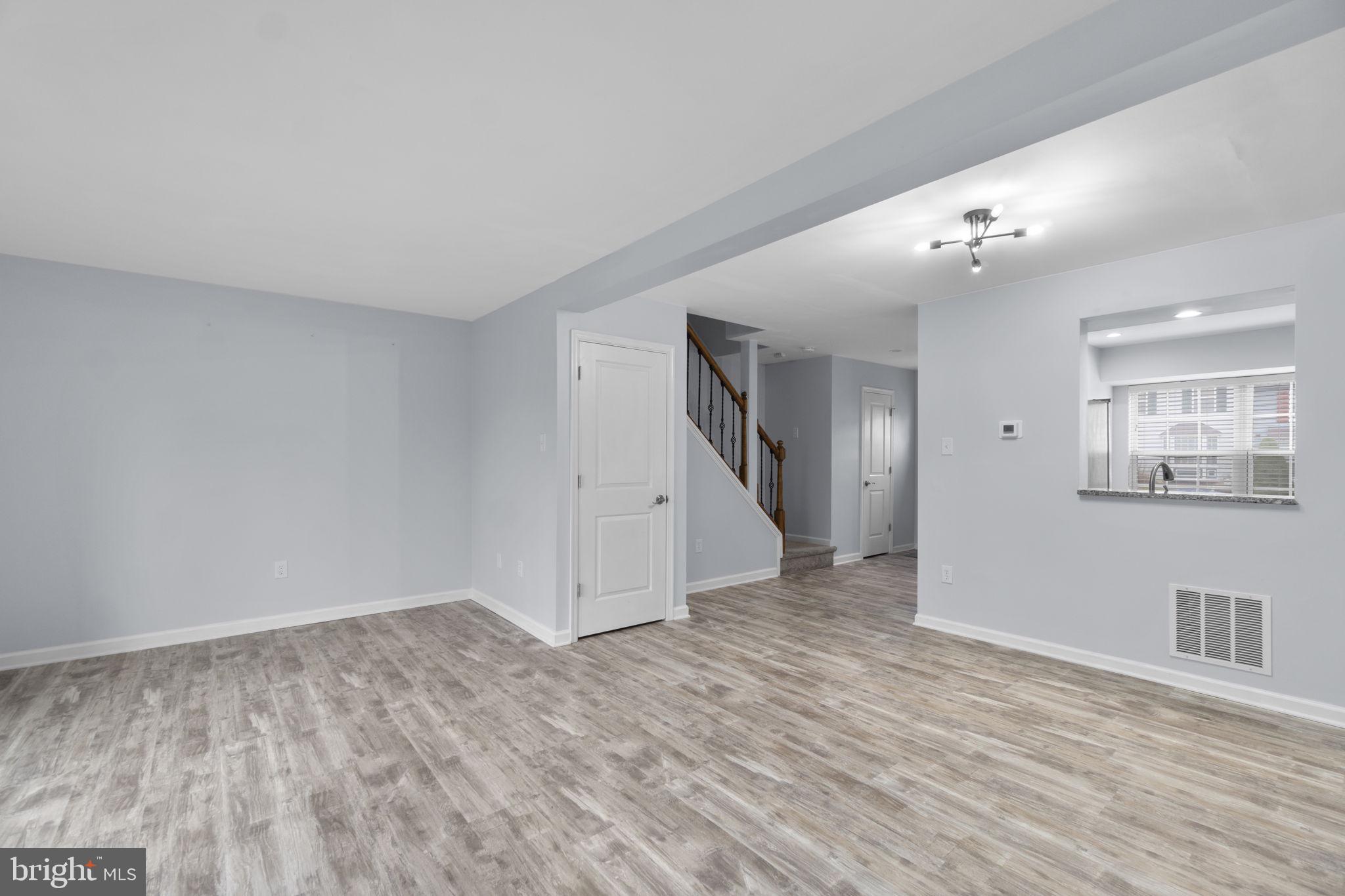 930 Gaming Square Hampstead, MD 21074 - Photo 7 of 36 a view of empty room with wooden floor and ceiling fan