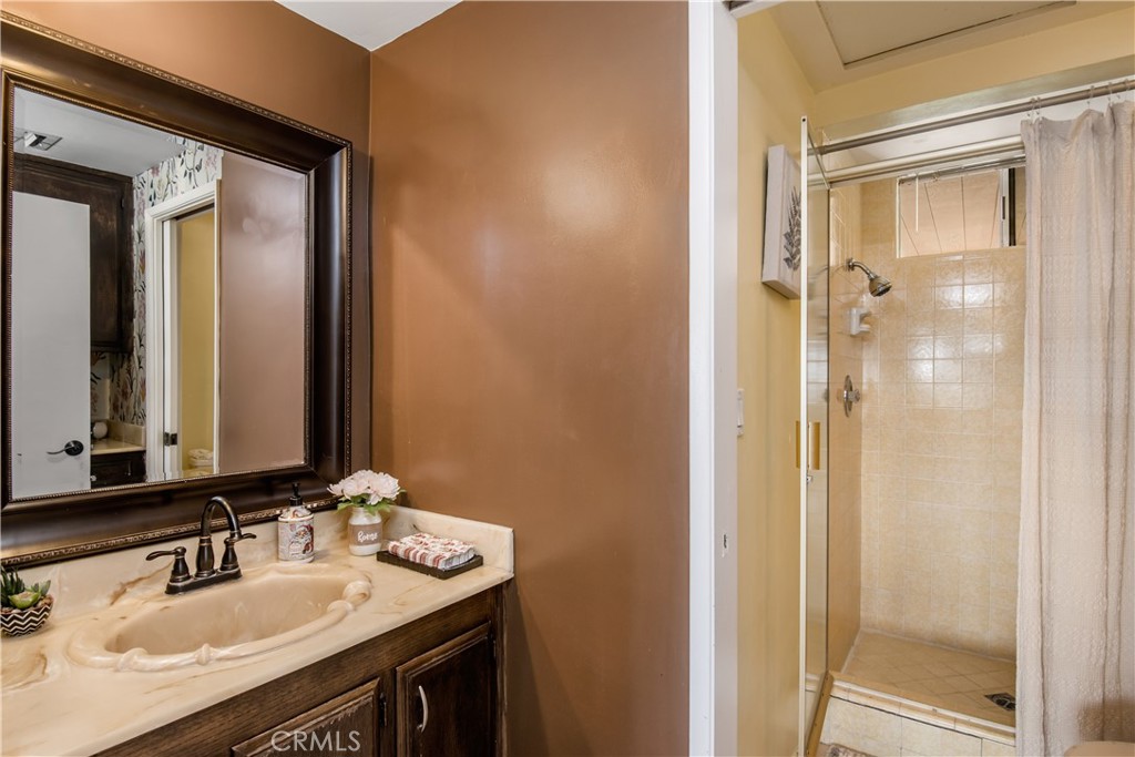 1036 Sherlock Drive Burbank, CA 91501 - Photo 14 of 28 a bathroom with a sink and a mirror