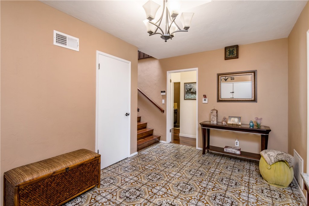 1036 Sherlock Drive Burbank, CA 91501 - Photo 15 of 28 a living room with furniture and a chandelier