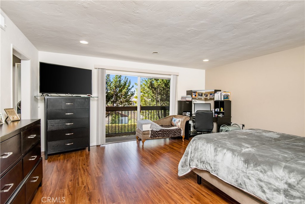 1036 Sherlock Drive Burbank, CA 91501 - Photo 16 of 28 a living room with furniture and a flat screen tv