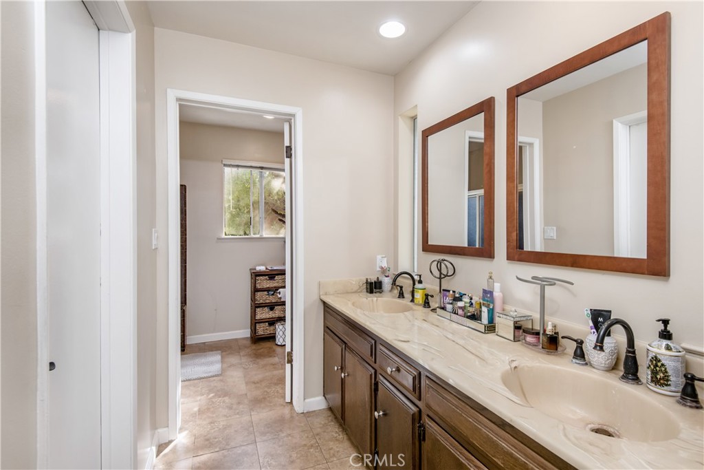 1036 Sherlock Drive Burbank, CA 91501 - Photo 18 of 28 a bathroom with a double vanity sink mirror and