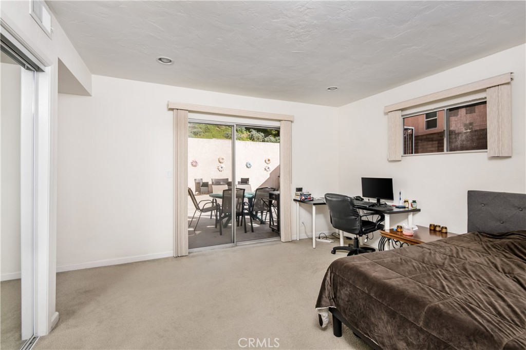 1036 Sherlock Drive Burbank, CA 91501 - Photo 19 of 28 a bed room with a bed and a chair