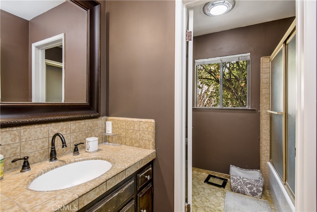 1036 Sherlock Drive Burbank, CA 91501 - Photo 20 of 28 a bathroom with a sink and a mirror