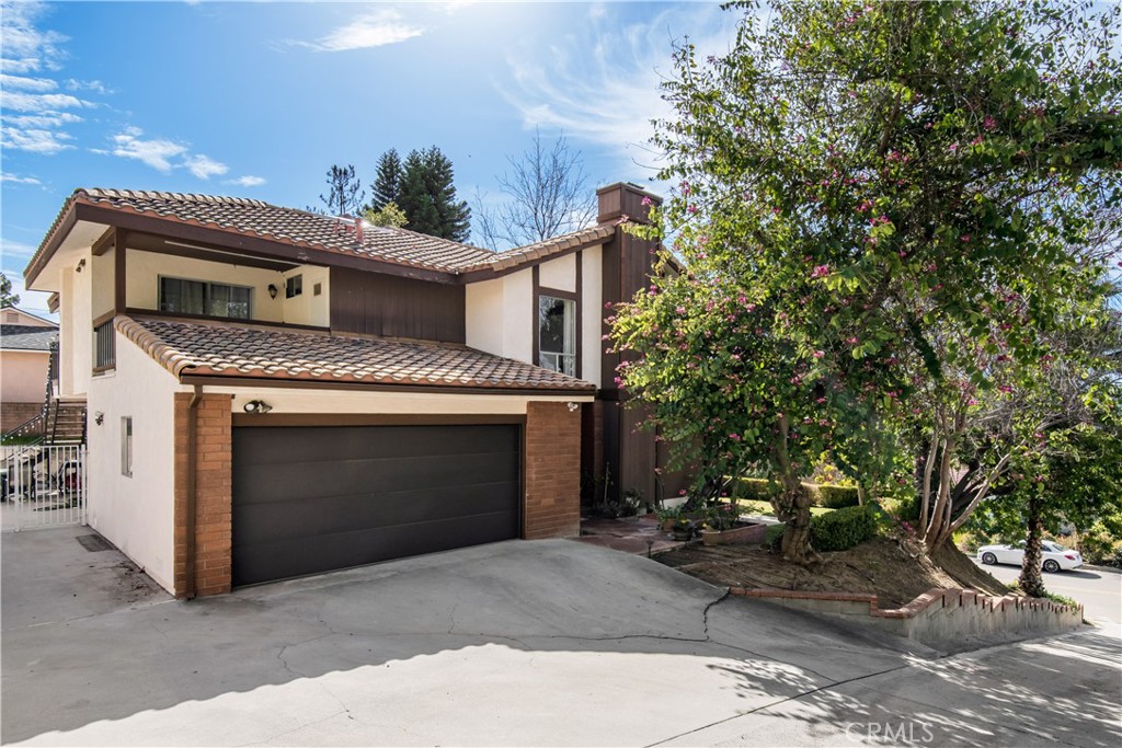1036 Sherlock Drive Burbank, CA 91501 - Photo 27 of 28 a house with trees in front of it