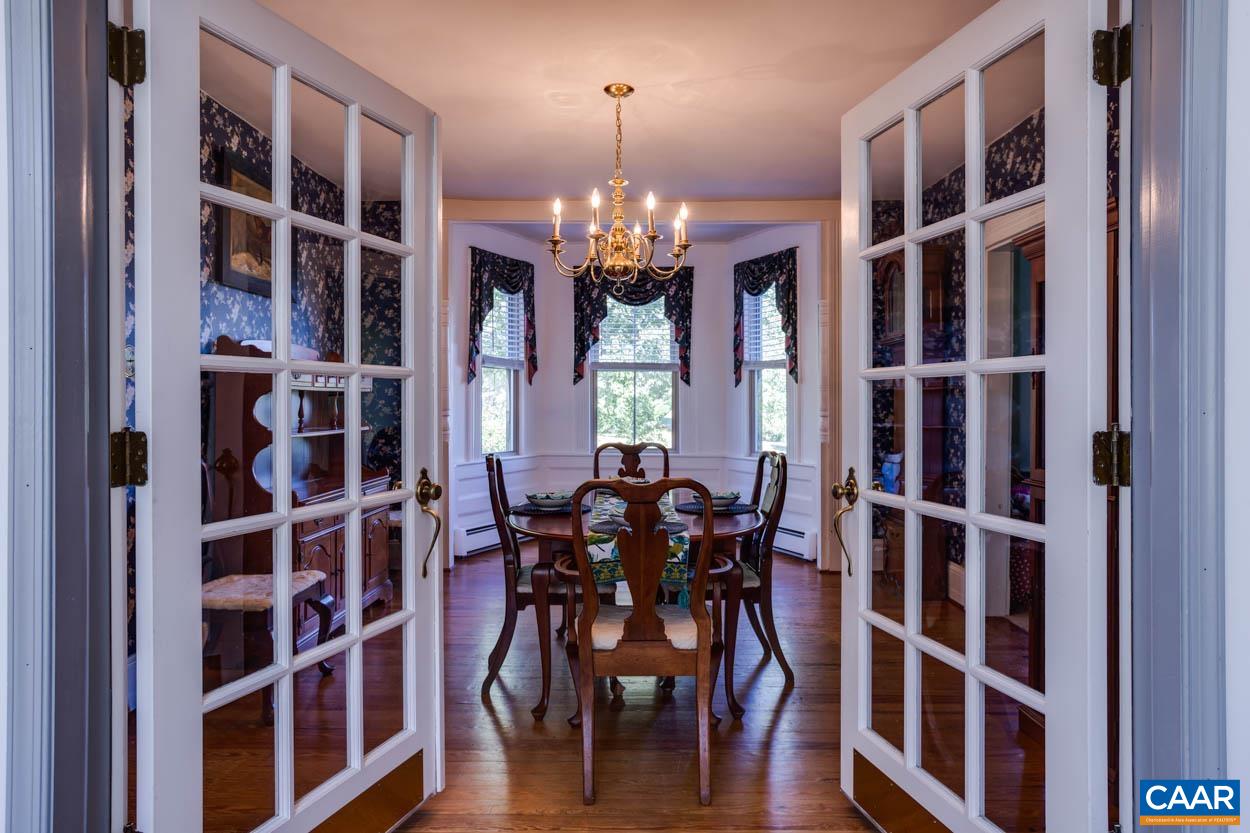 5407 South Blue Ridge Turnpike Rochelle, VA 22738 - Photo 26 of 72 a view of a dining room with furniture and chandelier