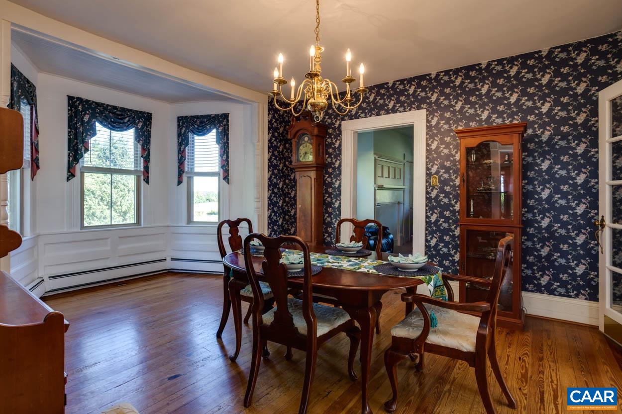 5407 South Blue Ridge Turnpike Rochelle, VA 22738 - Photo 29 of 72 a view of a dining room with furniture window and wooden floor