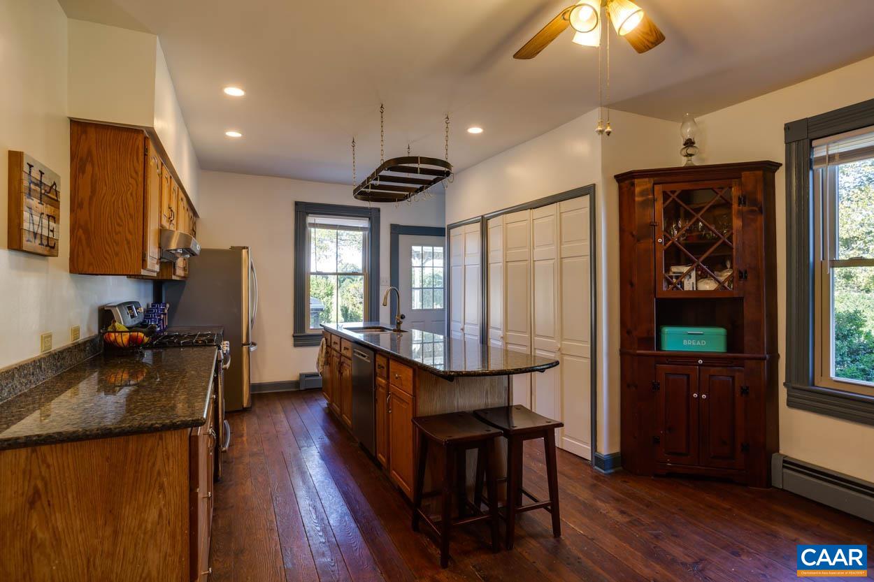 5407 South Blue Ridge Turnpike Rochelle, VA 22738 - Photo 30 of 72 a kitchen with sink cabinets and wooden floor
