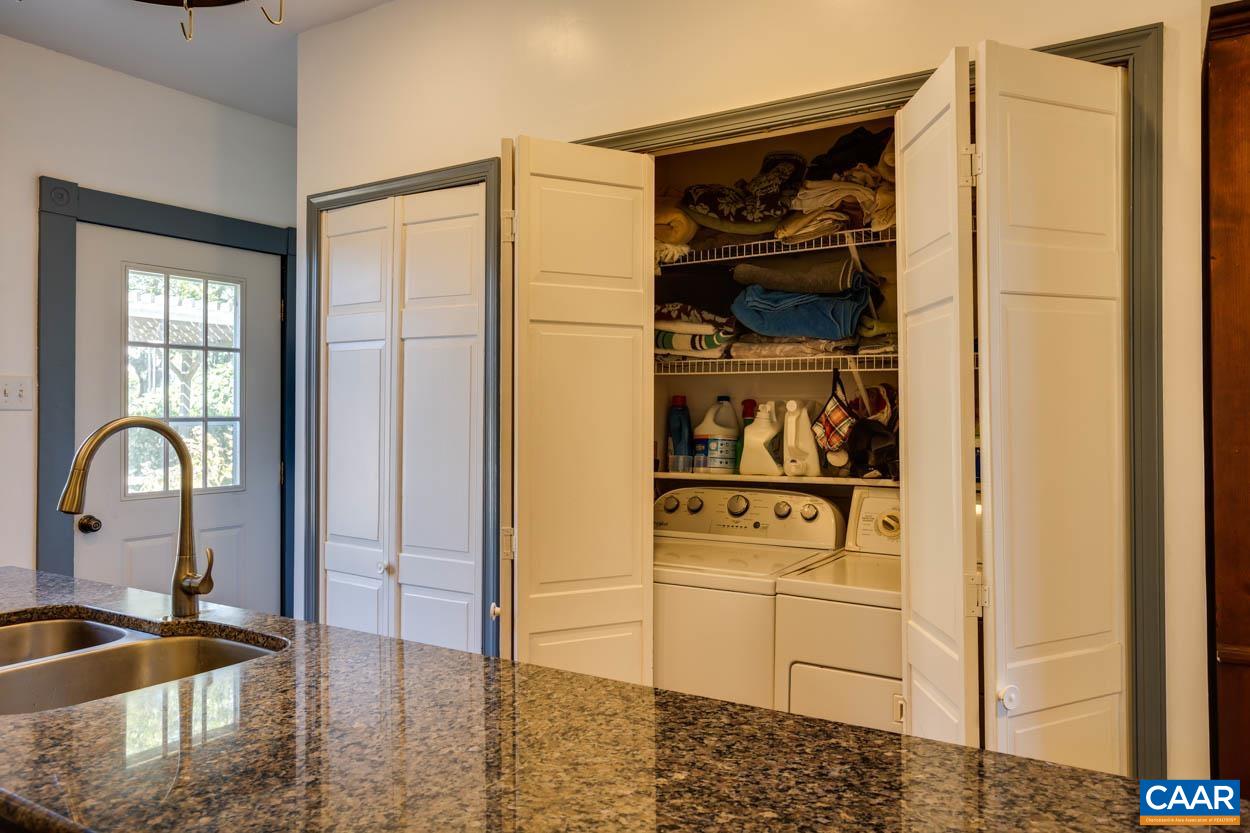 5407 South Blue Ridge Turnpike Rochelle, VA 22738 - Photo 33 of 72 a kitchen with a refrigerator and a sink