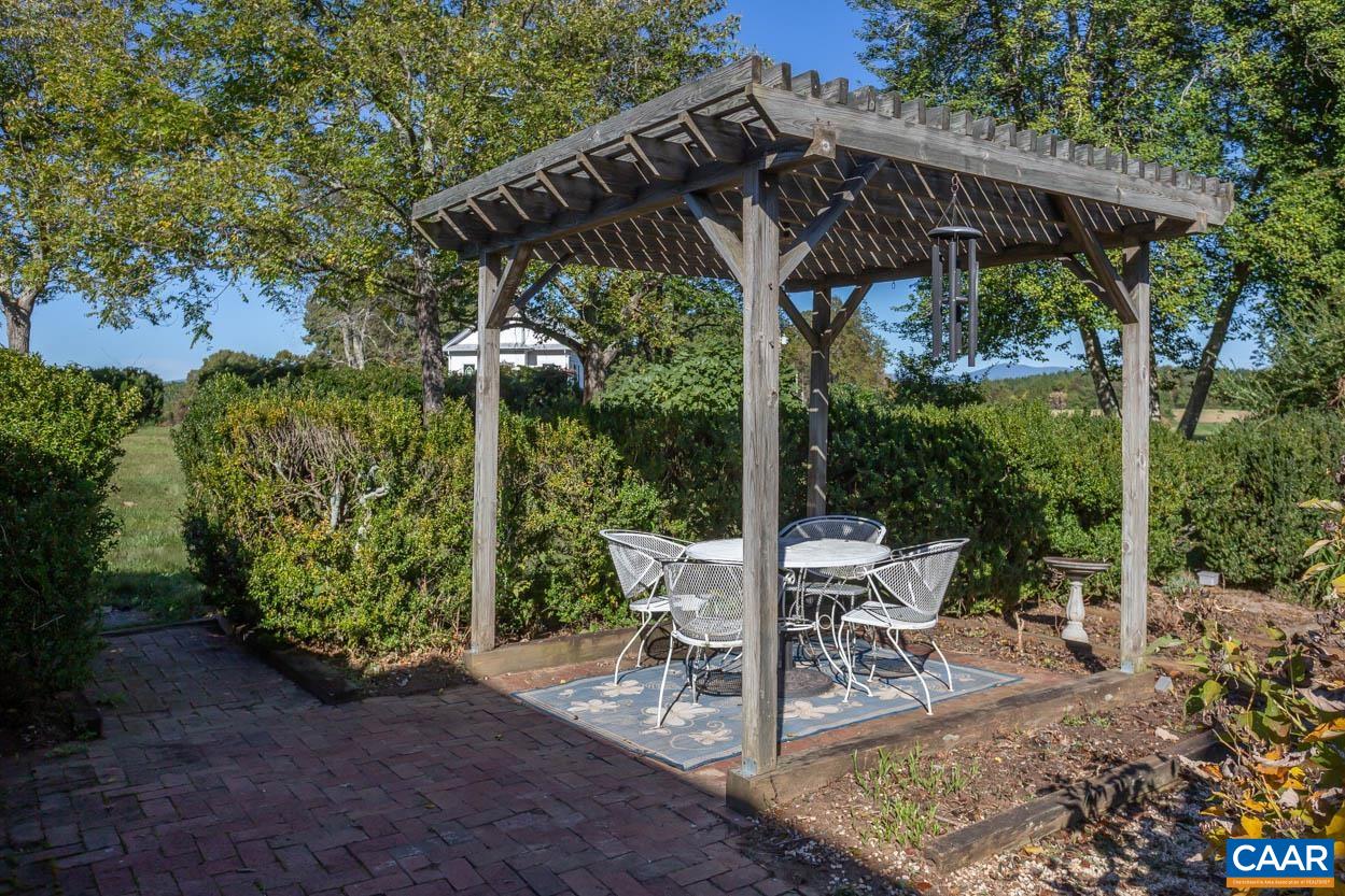 5407 South Blue Ridge Turnpike Rochelle, VA 22738 - Photo 48 of 72 a view of patio with table and chairs potted plants