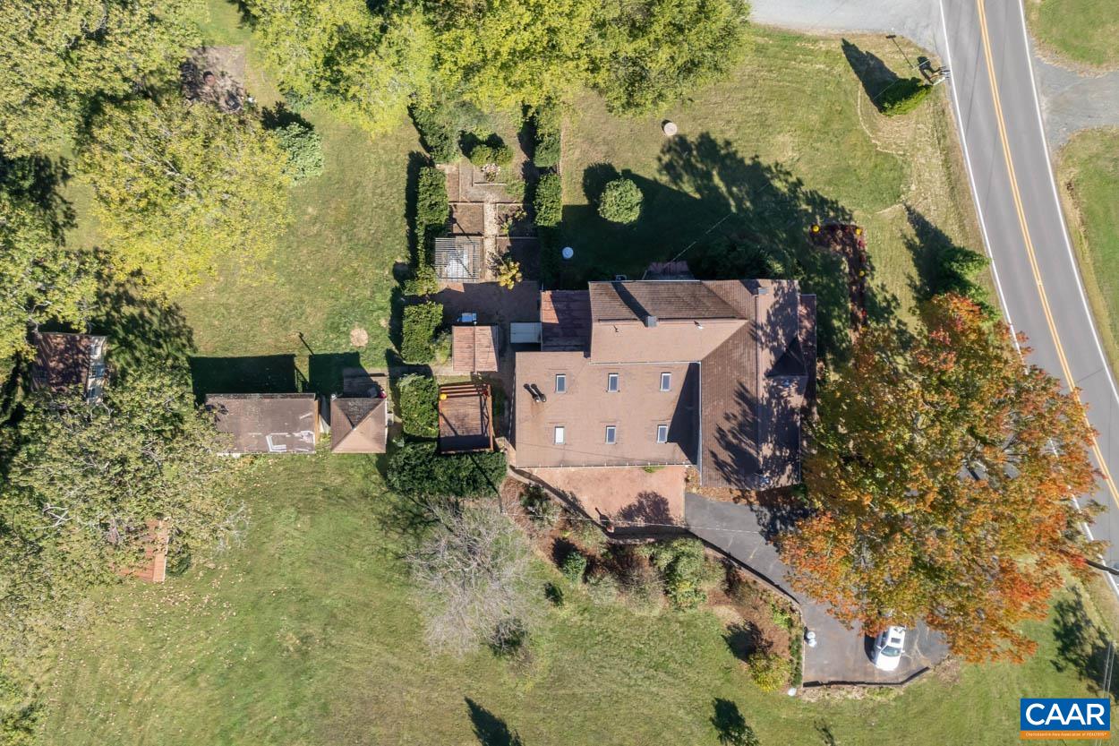 5407 South Blue Ridge Turnpike Rochelle, VA 22738 - Photo 59 of 72 an aerial view of a house with a yard and large trees