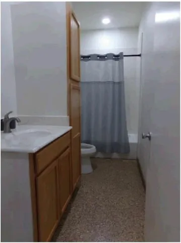 a kitchen with refrigerator and window