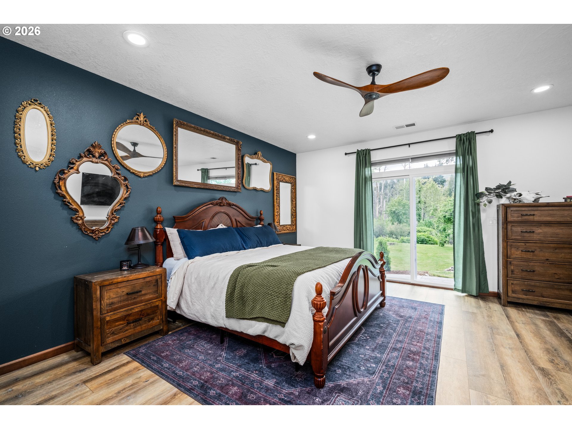 45542 South Gate Creek Road Vida, OR 97488 - Photo 6 of 46 a bedroom with a bed and a large window