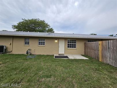 3005 Gordon Street Naples, FL 34112 - Photo 11 of 11 Rear view of house featuring a patio, stucco siding, and a fenced backyard
