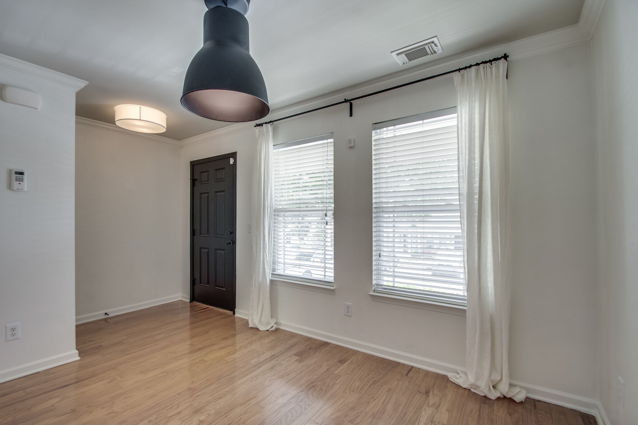1382 Rural Hill Road, Unit 147 Antioch, TN 37013 - Photo 6 of 35 a view of an empty room with window and wooden floor