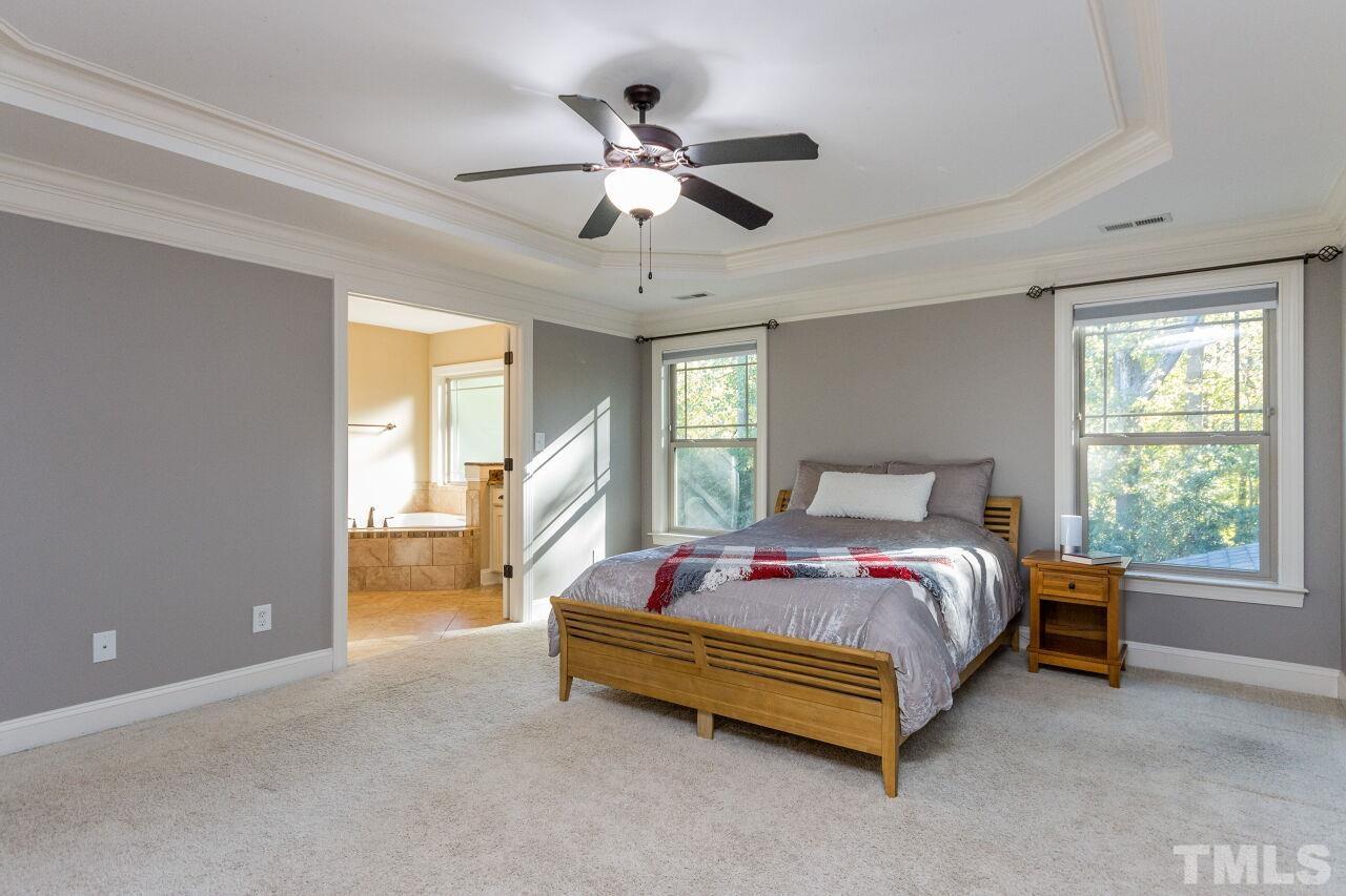 1340 Trinity Road Cary, NC 27513 - Photo 15 of 30 a bedroom with a bed and window