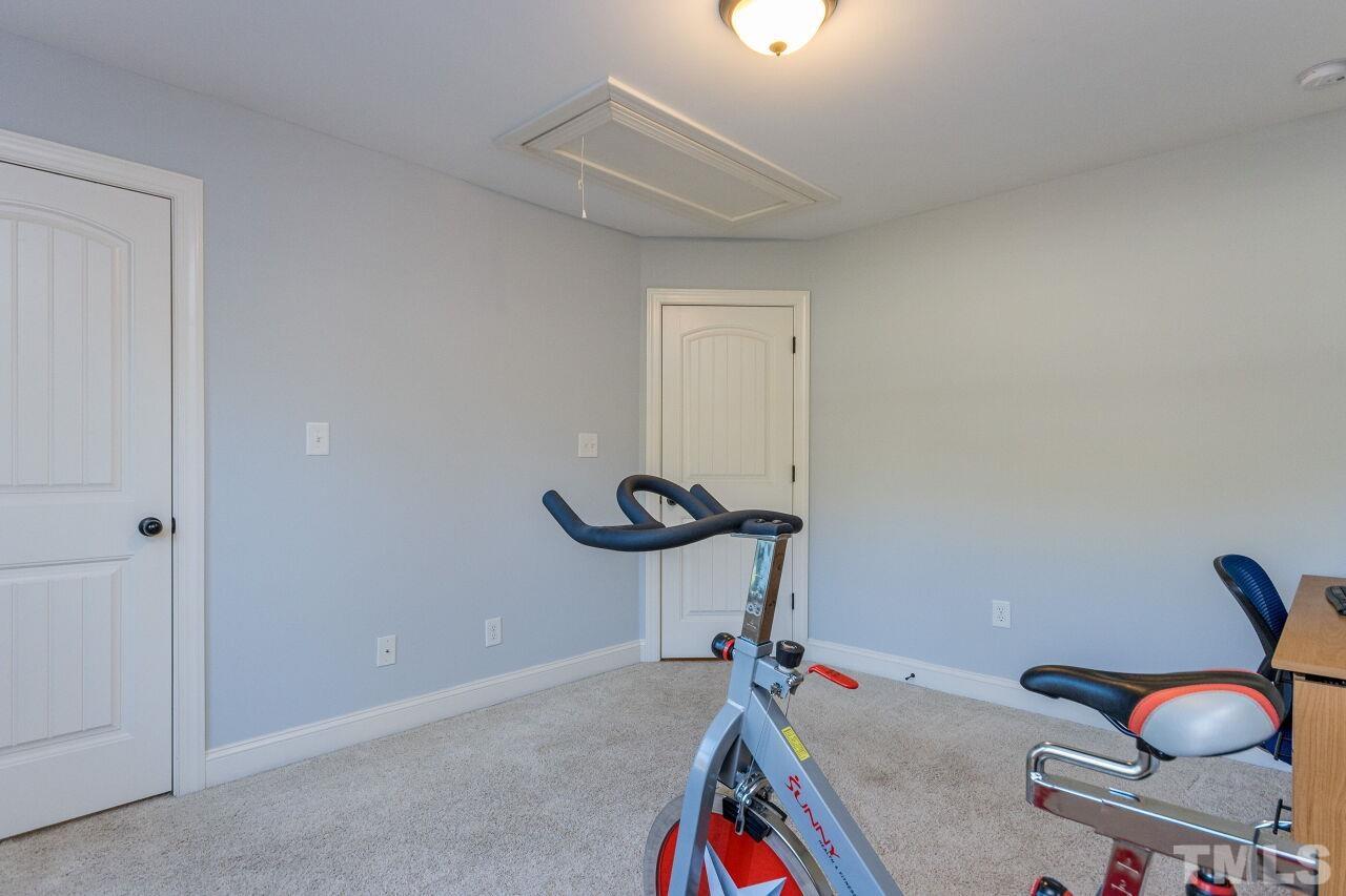1340 Trinity Road Cary, NC 27513 - Photo 23 of 30 a view of a room with gym equipment