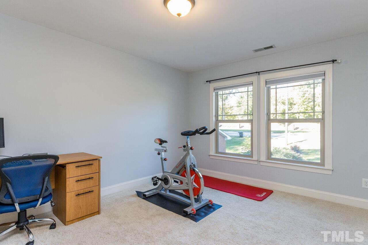 1340 Trinity Road Cary, NC 27513 - Photo 24 of 30 a view of a room with gym equipment
