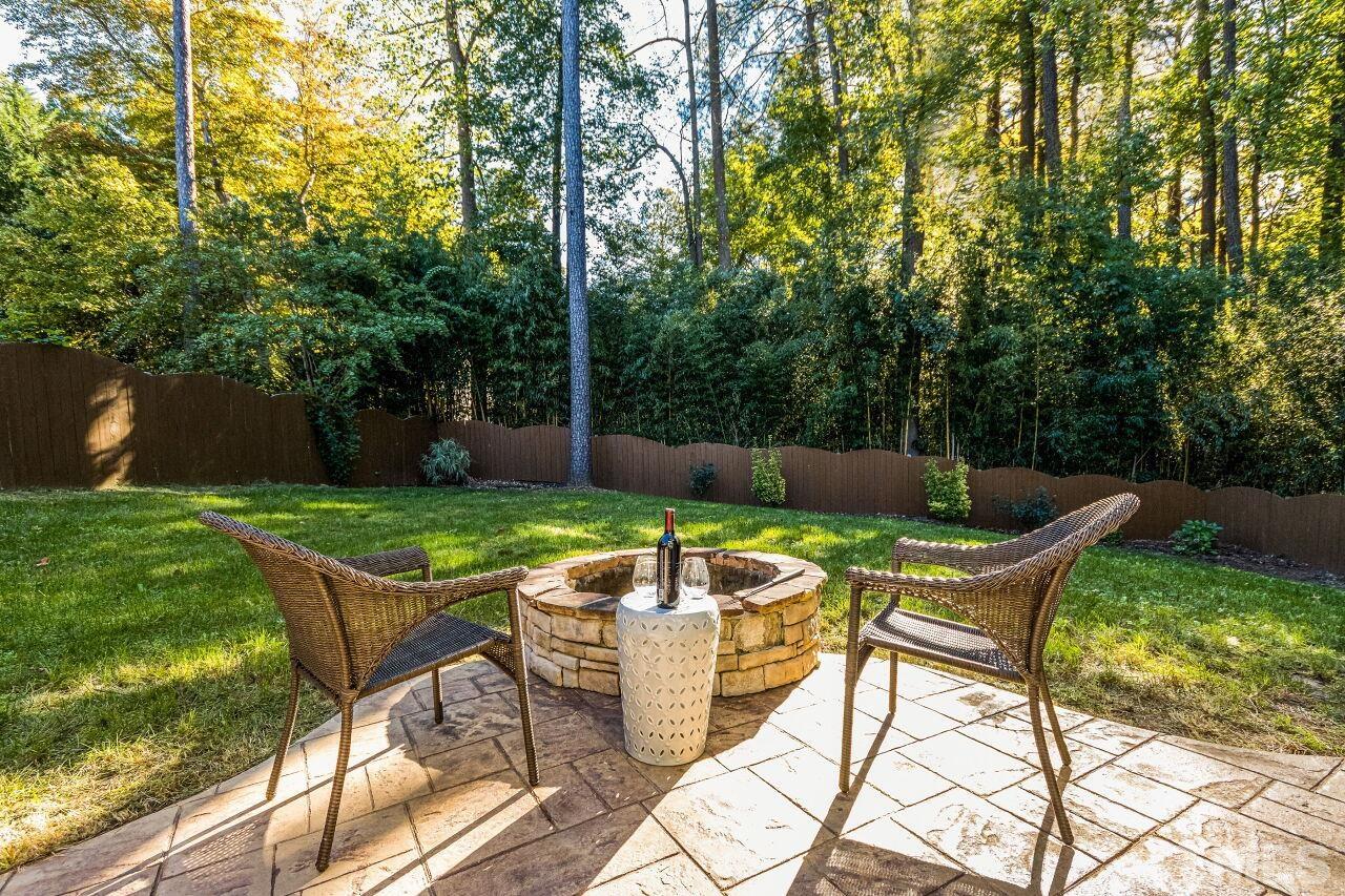 1340 Trinity Road Cary, NC 27513 - Photo 28 of 30 a view of a backyard with sitting area and garden