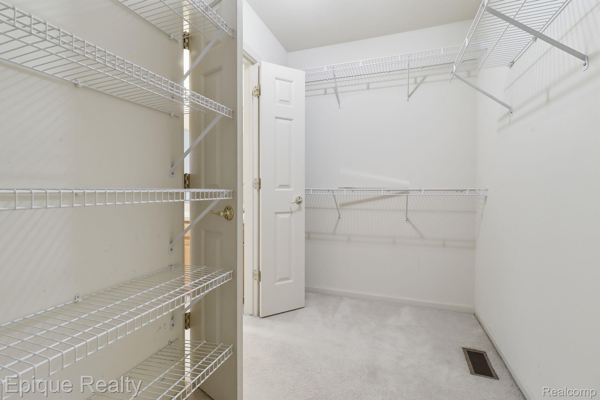 321 Cherry Grove Road Canton, MI 48188 - Photo 16 of 22 Walk in closet with light carpet