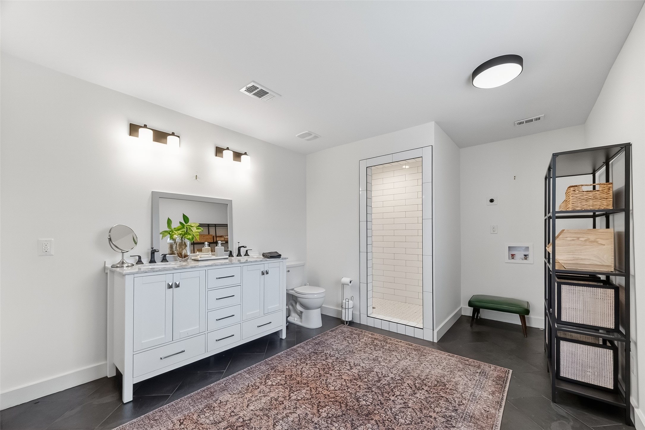 1808 Tabor Street Houston, TX 77009 - Photo 21 of 26 This spacious bathroom was fully remodeled with a lovely walk-in shower and dual sink vanity.