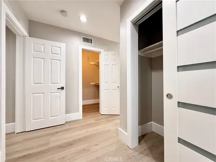 a kitchen with a sink a window and cabinets