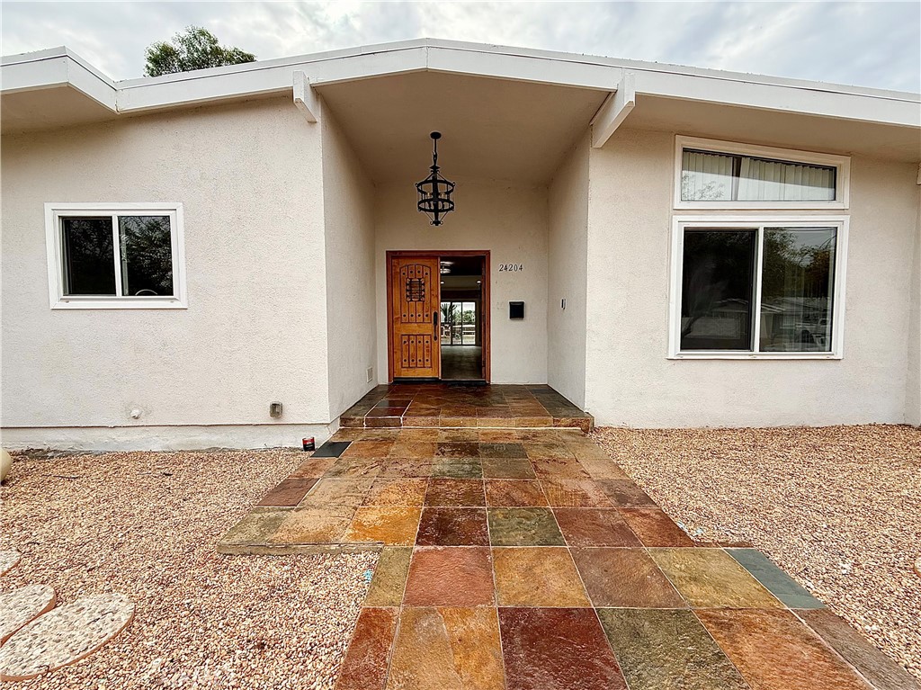 24204 Calvert Street Woodland Hills, CA 91367 - Photo 2 of 70 a view of an entrance of the house