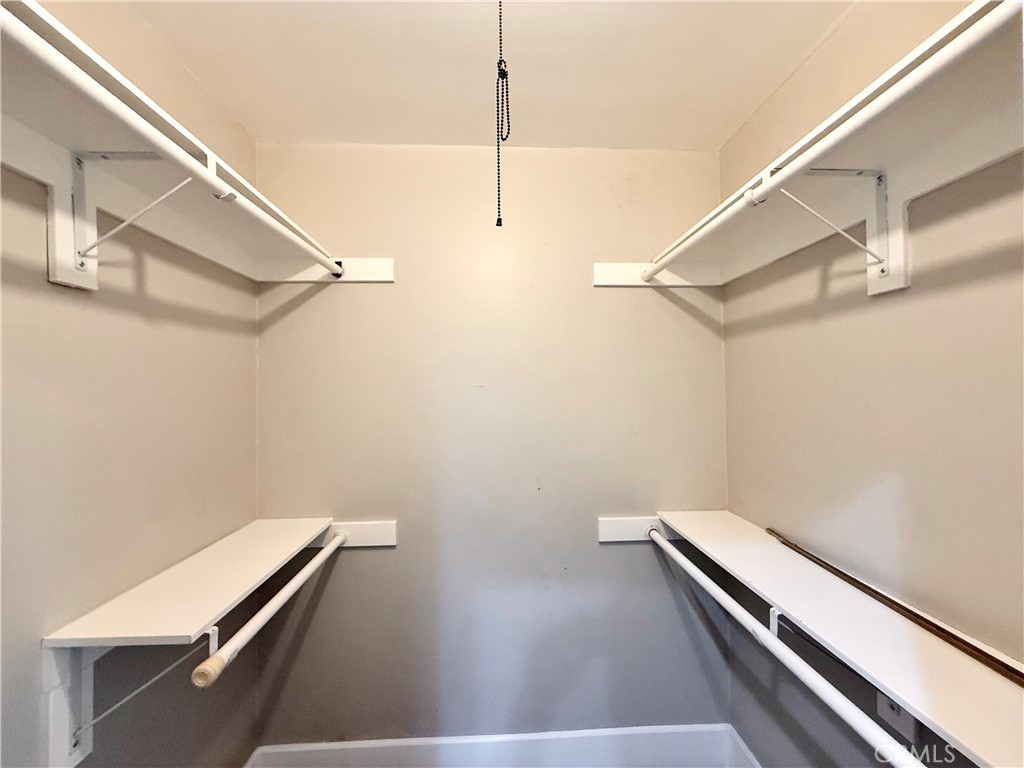 24204 Calvert Street Woodland Hills, CA 91367 - Photo 21 of 70 a view of a room with racks on the wall