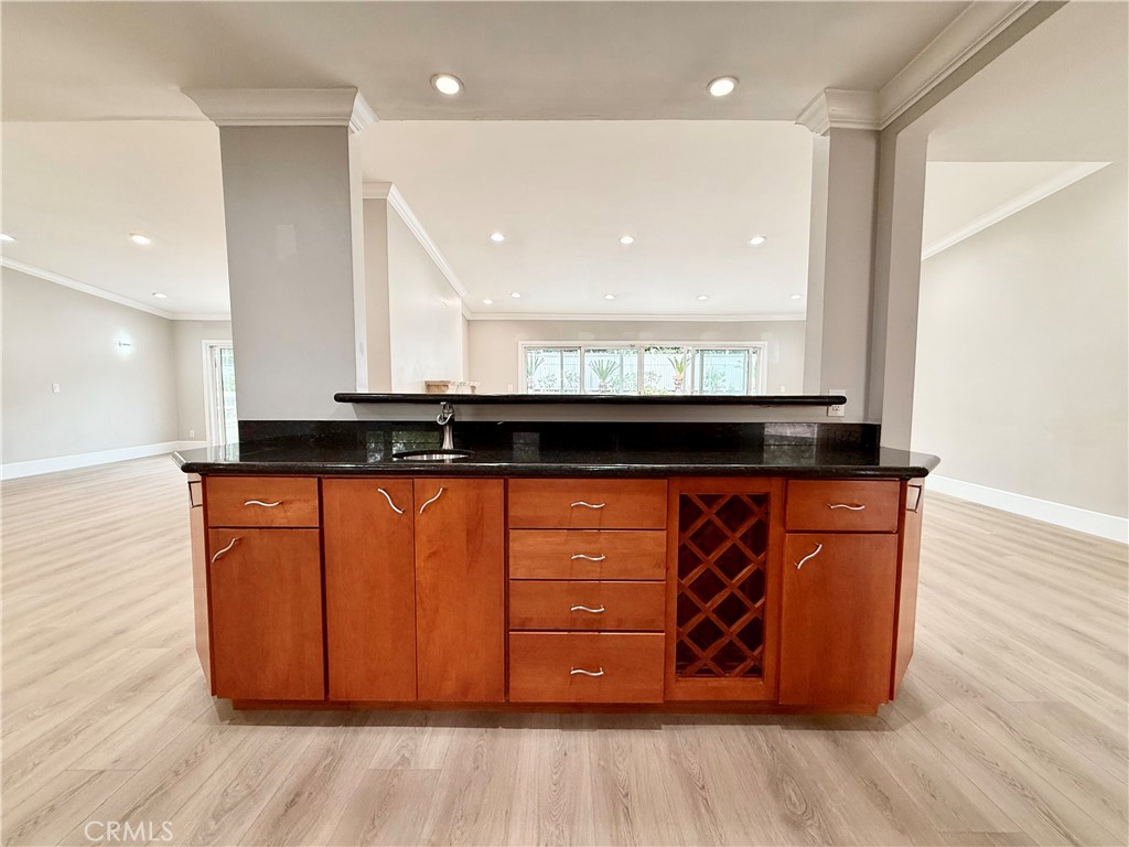 24204 Calvert Street Woodland Hills, CA 91367 - Photo 55 of 70 a close view of a sink a mirror and a cabinet