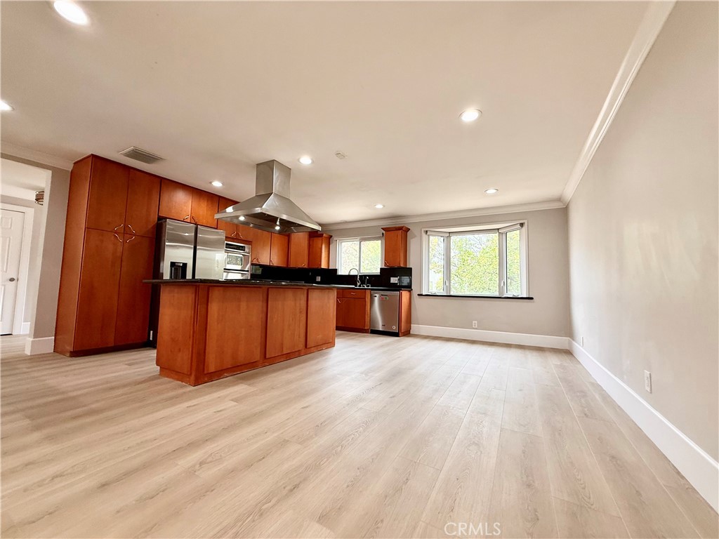 24204 Calvert Street Woodland Hills, CA 91367 - Photo 62 of 70 a view of a big room with wooden floor and windows