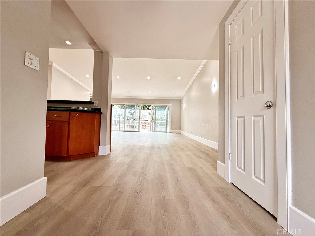 24204 Calvert Street Woodland Hills, CA 91367 - Photo 70 of 70 a view of an empty room with wooden floor and a window