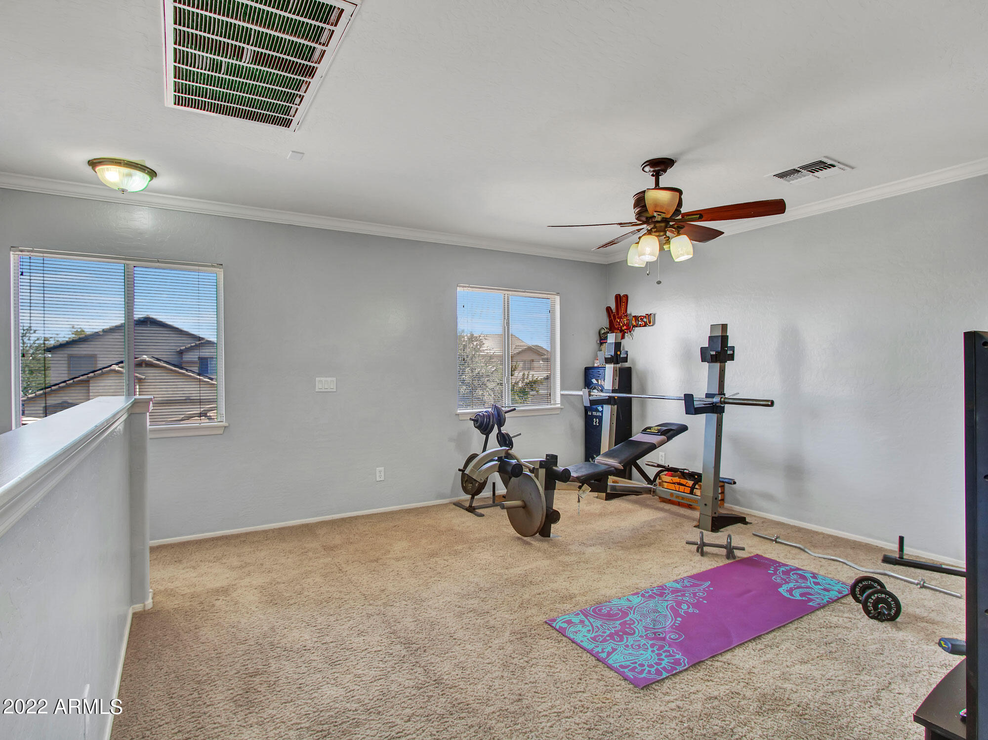 11645 West Mountain View Road Youngtown, AZ 85363 - Photo 24 of 45 a view of a workspace with furniture and a window
