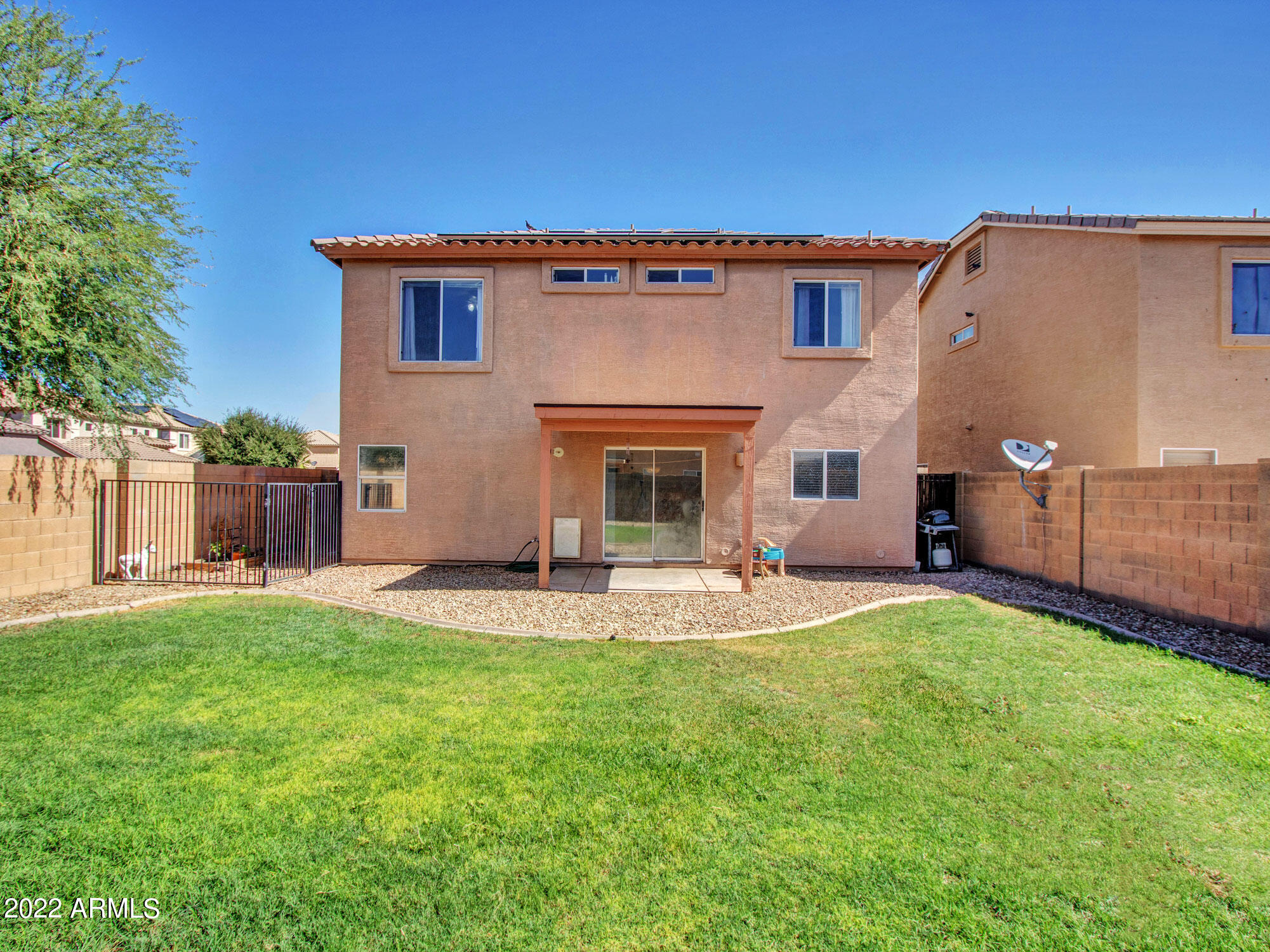 11645 West Mountain View Road Youngtown, AZ 85363 - Photo 38 of 45 a front view of a house with a garden and yard